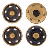 Four antique brass snap buttons, two with dark centers and white inserts, two with open springs. DRUKKNOOP-30-BRONS-2ST