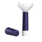 A dark purple needle twister with a white base and a cap lying next to it. Contains many silver needles. PRYM610291 4002276102910