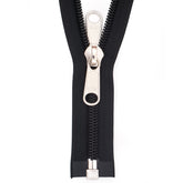 Close-up of a black YKK zipper with silver double-sided puller, visible YKK logo on puller and bottom stop. YKK-TENT-DB-DZ-250-BRUIN