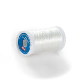 Hilo elástico transparente en carrete, con logo Prym. 'Strick-Elastic Knitting-in Elastic' y '100% Elasthan, Hanelast'. PRYM977770 4002279105505