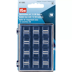 Verpakking van Prym spoelhouder met 12 metalen CB spoelen, met productinformatie en naaimachine icoon, EAN 4002276119857 | PRYM-611985 | 4002276119857